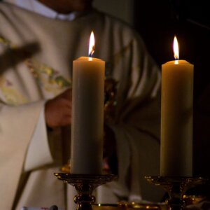 Why does the Church use candles?